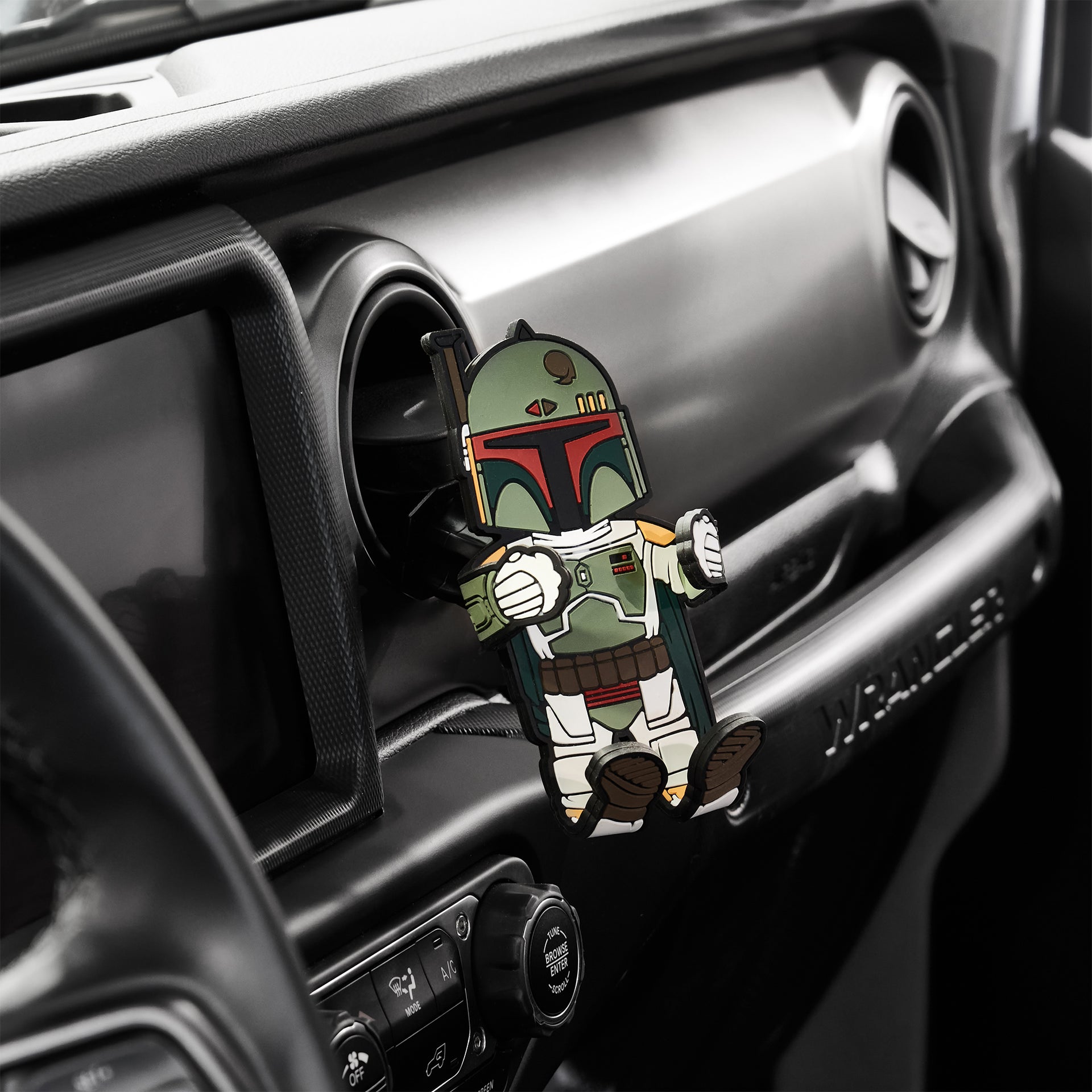 Image of Star Wars Boba Fett Hug Buddy attached to a vehicle air vent waiting to hold a phone or smart device on your next journey!