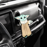 Image of Star Wars the Mandalorian Grogu Hug Buddy attached to a car air vent waiting to have a cell-phone or smart device like a GPS added to its grasp