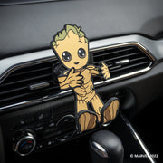 Image of Marvel Groot Hug Buddy attached to a car air vent, awaiting a cell-phone to be placed in its grasp