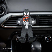 Image of Marvel Comics Venom Hug Buddy attached to a vehicle air vent with arms and legs in the closed position ready to hold a phone or other smart device