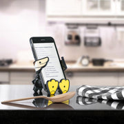 Image of Crumbs the duck Hug Buddy holding a cell phone on top of a kitchen island with a recipe displayed on the phone screen