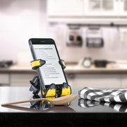 Image of Relaxa the Llama Hug Buddy holding a phone with a recipe on the screen, on top of a kitchen counter