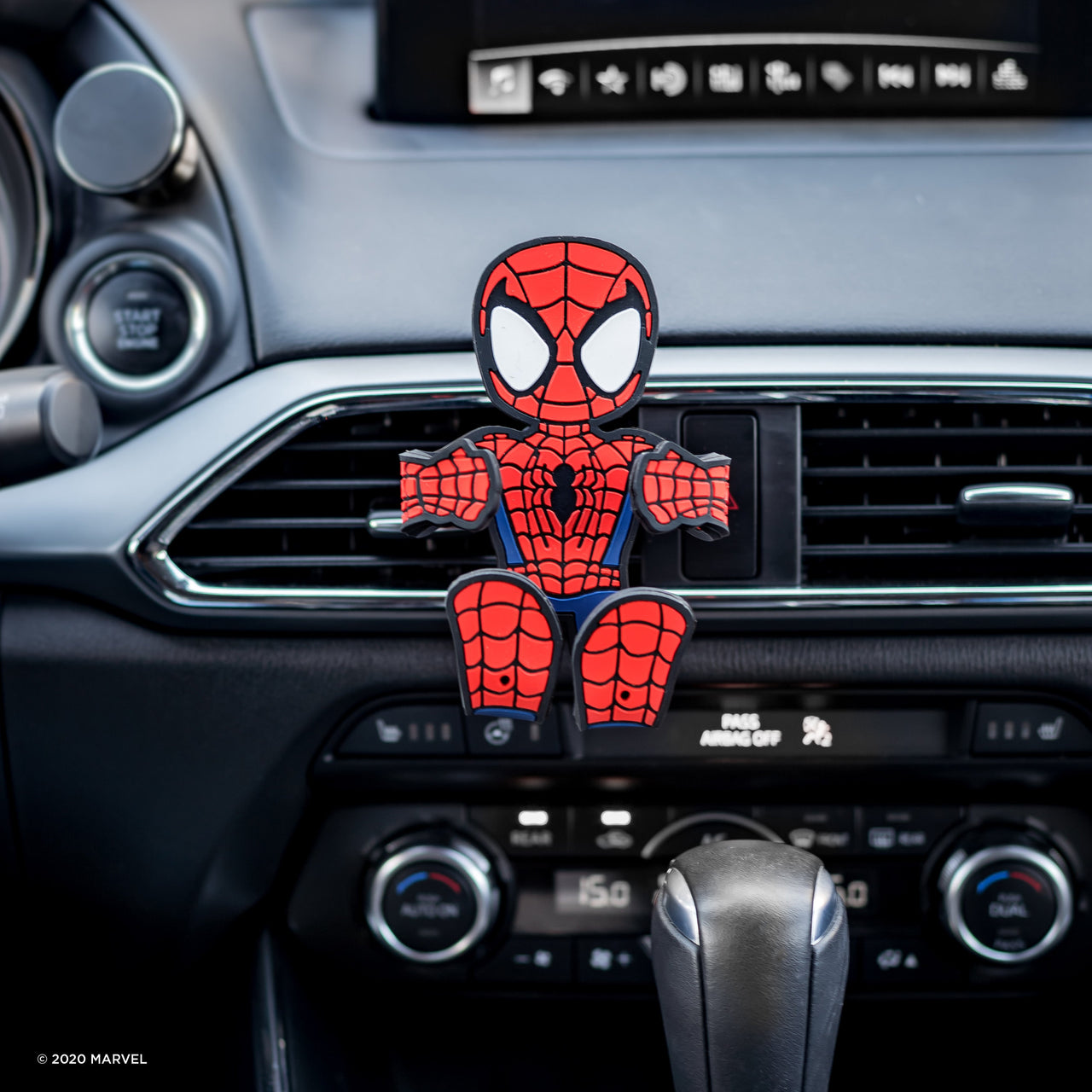 Image of Marvel Comics Spider-Man Hug Buddy with arms and legs in the folded closed position attached to a car air vent, ready to hold a cell-phone or other smart device