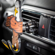 Image of Stripes the Eagle Hug Buddy attached to a car air vent with arms and legs in the closed position, ready to hold a phone or GPS or other smart device. Close-up shot of the air vent clip attached to the air vent of the car.