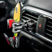 Image of Shaky the fish bait Hug Buddy attached to a car air vent with arms and legs folded, ready to hold your phone on your next adventure. Close-up image of the vent clip.